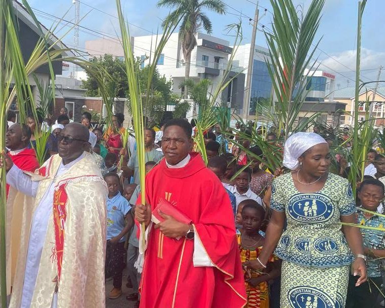 The parish in procession on Palm Sunday, clergy and congregation carrying palms